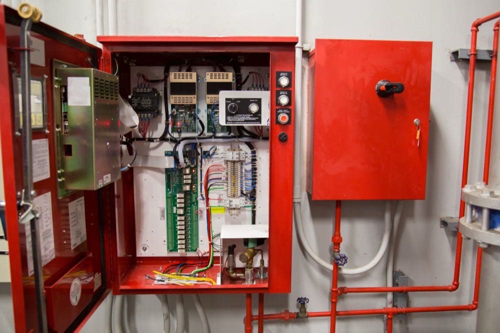 Industrial fire alarm control system panel representing ERRCS compliance