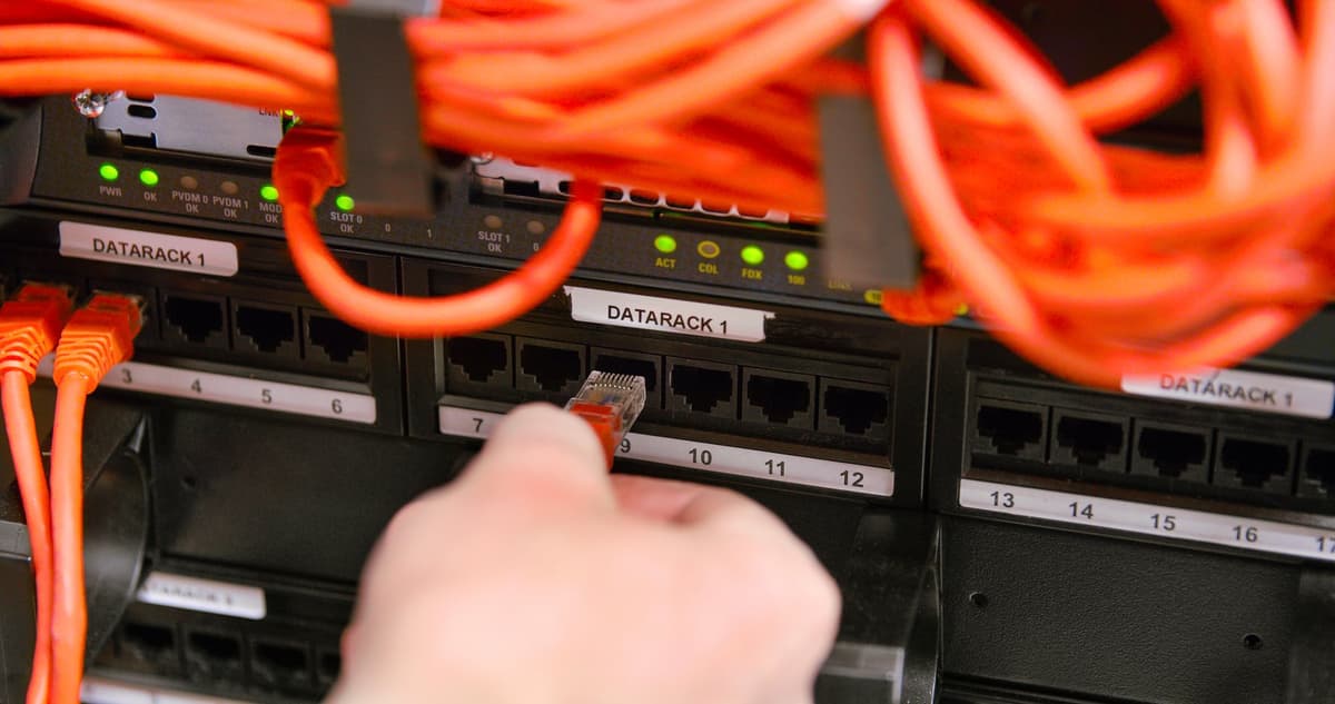 Mytek Pros technician terminating a structured cabling patch panel