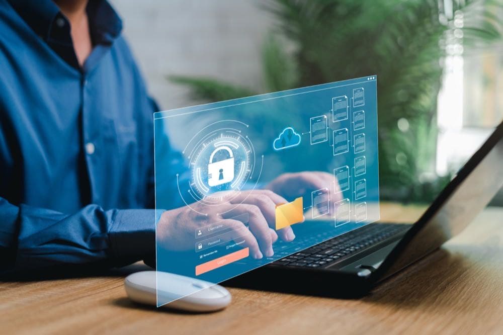 Businessman securing data on a laptop, representing data privacy protection under CCPA