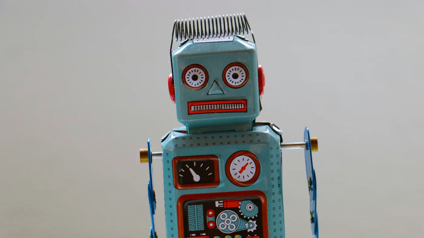 Vintage wind-up toy robot, illustrating automation