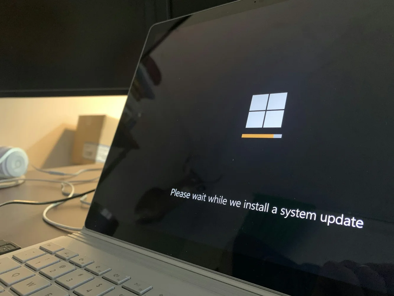 Laptop displaying a Windows system update in progress