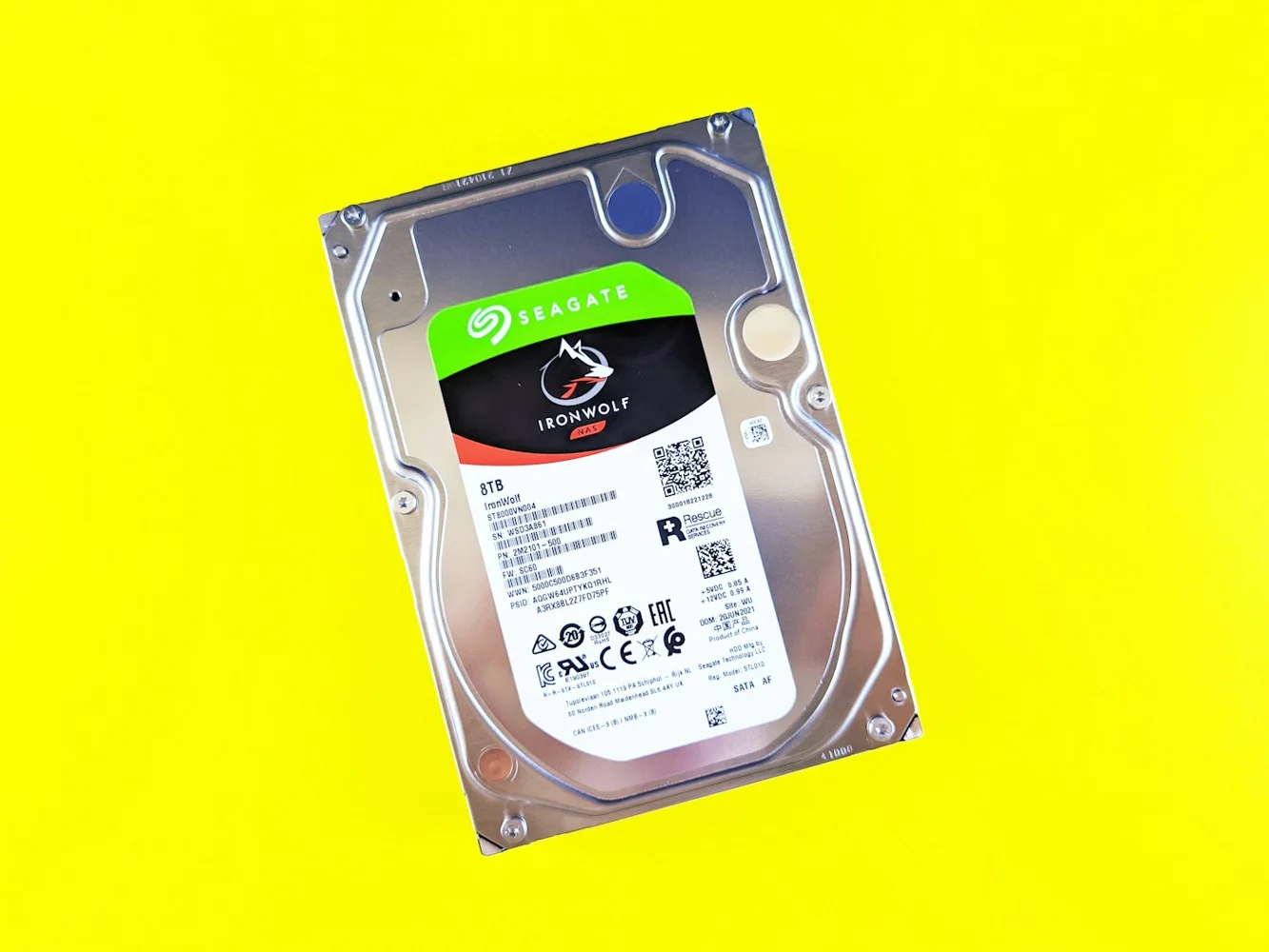 Computer hard drive on a yellow background