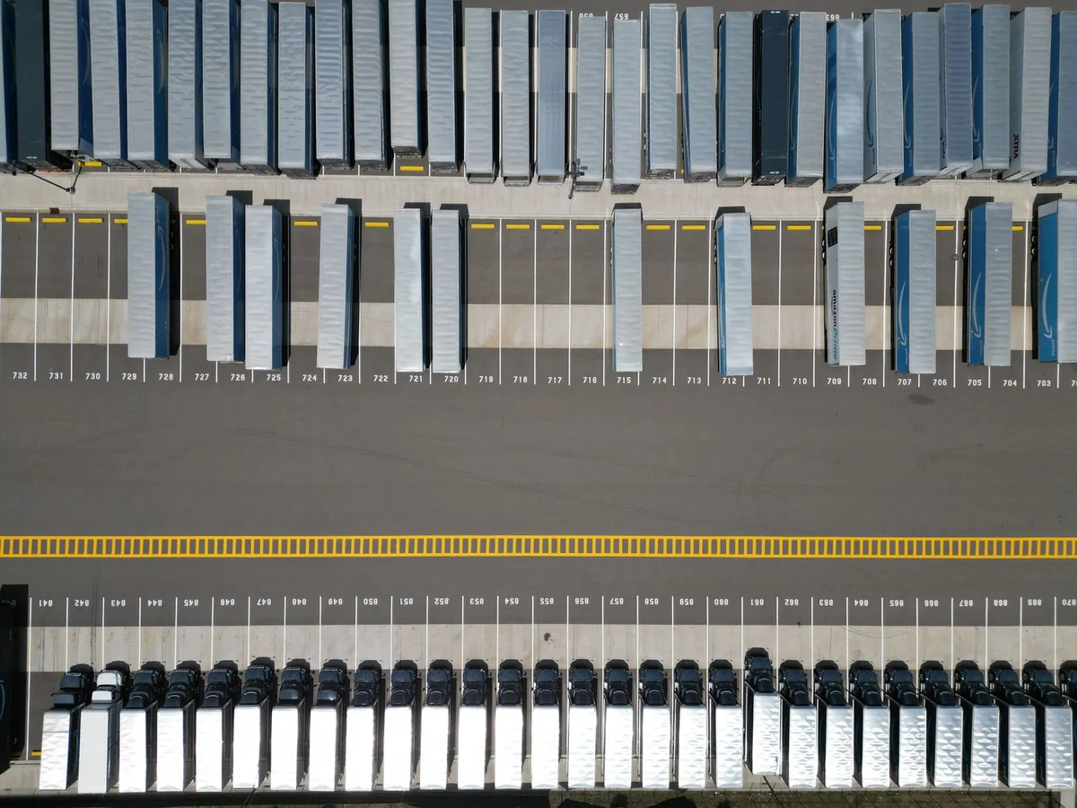Top-down view of rows of freight trailers and a marked internal vehicle route.