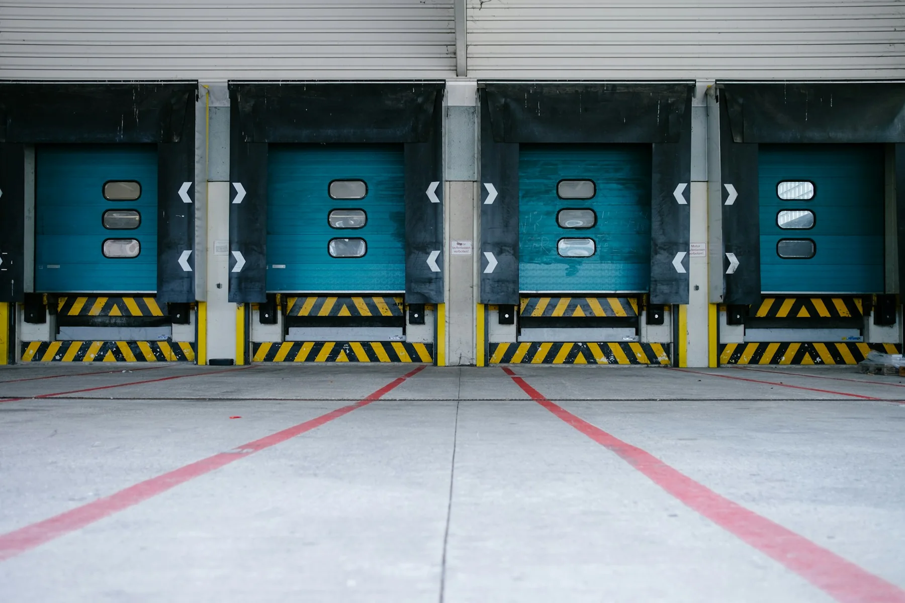 Loading docks with marked approach lanes at a distribution building.