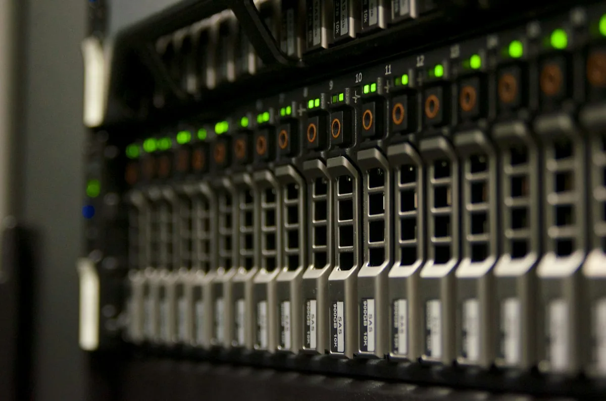 A close view of rack-mounted computing equipment with illuminated status indicators.