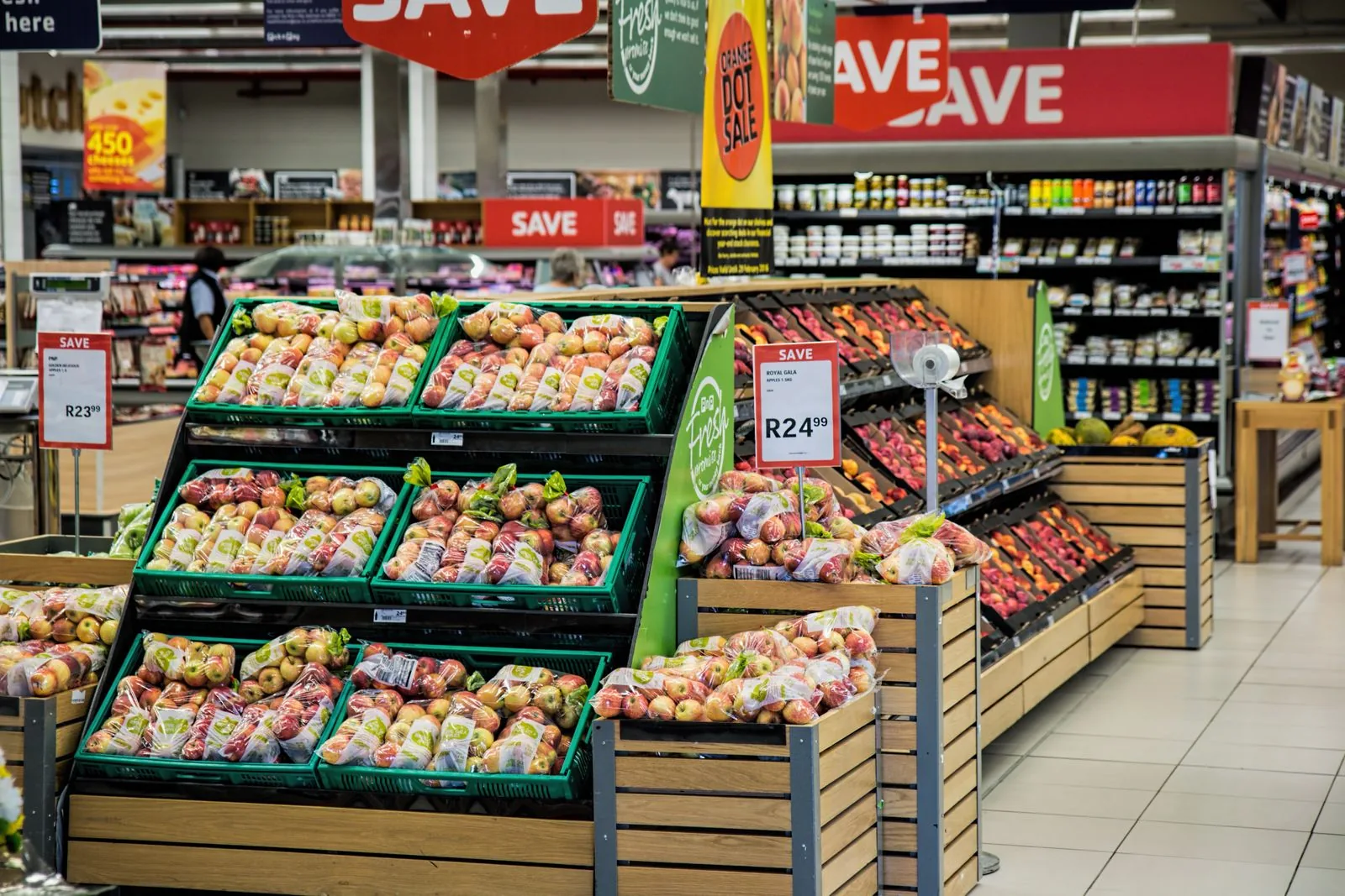 Produce displays and stocked aisles inside a supermarket.